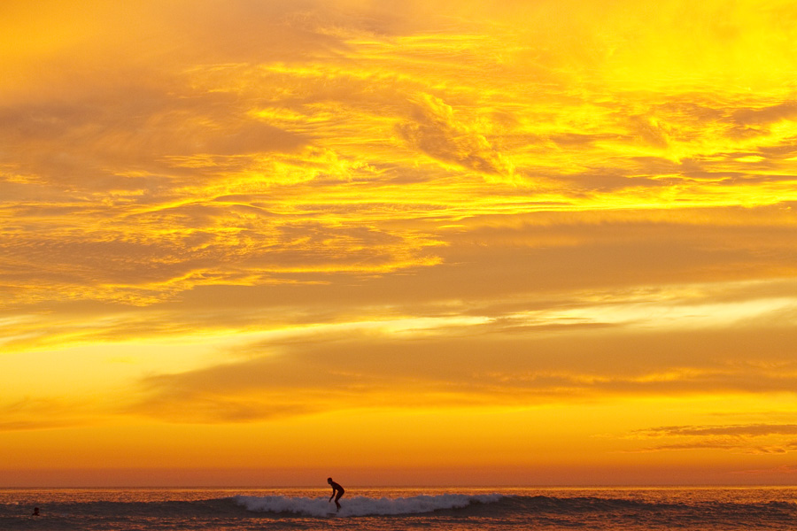Amazing sunset and surfer